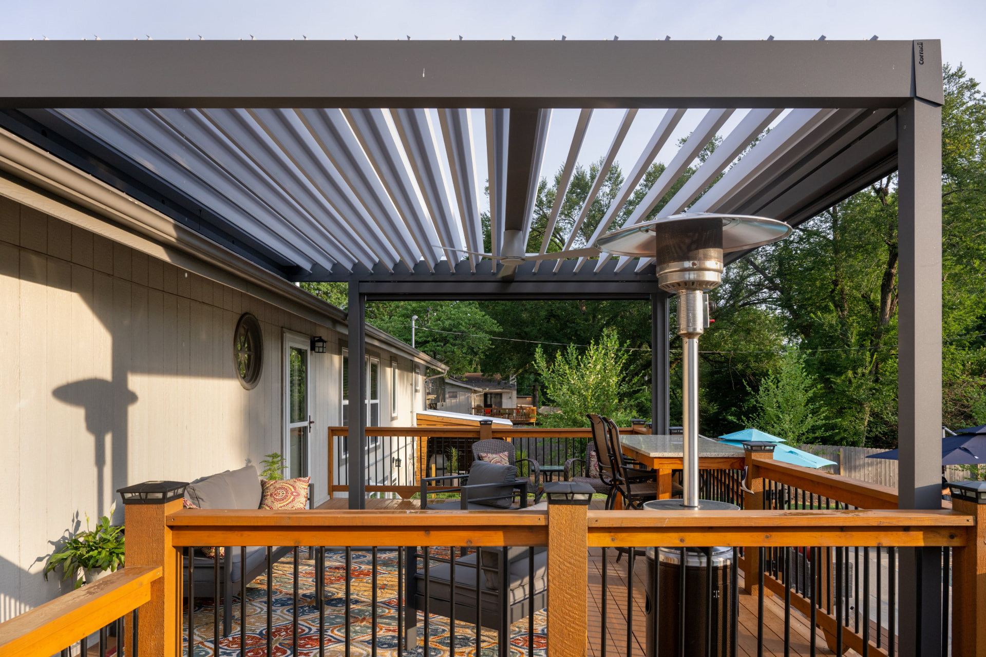 Louvered Corradi pergola over a Kansas City deck